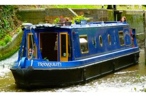 A blue narrowboat called tranquility